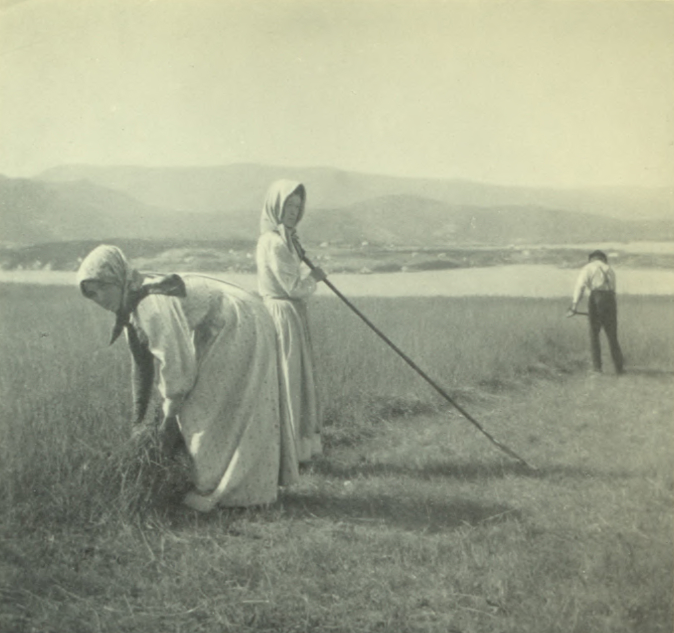 Two women working in the fields.