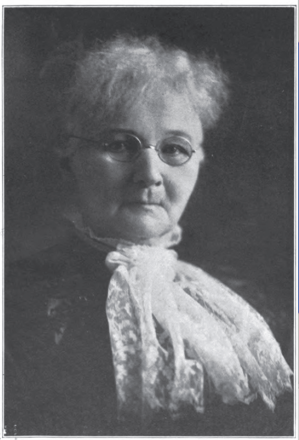 portrait of woman with glasses and lace scarf