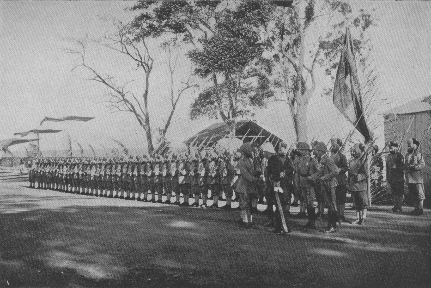 regimented line of men in uniform with rifles
