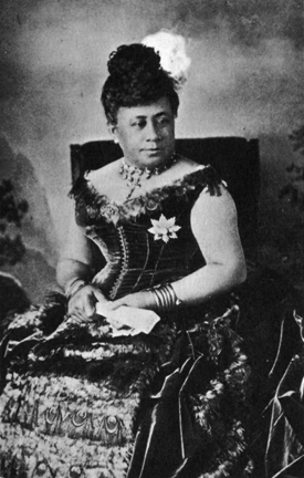 seated woman in sleeveless corseted dress