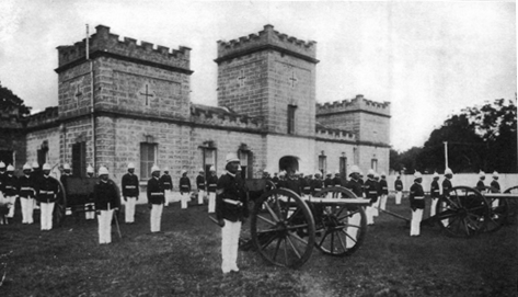 men in military uniforms outside stone building with towers