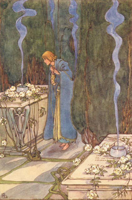 young woman in cloak in a graveyard with two raised tombs