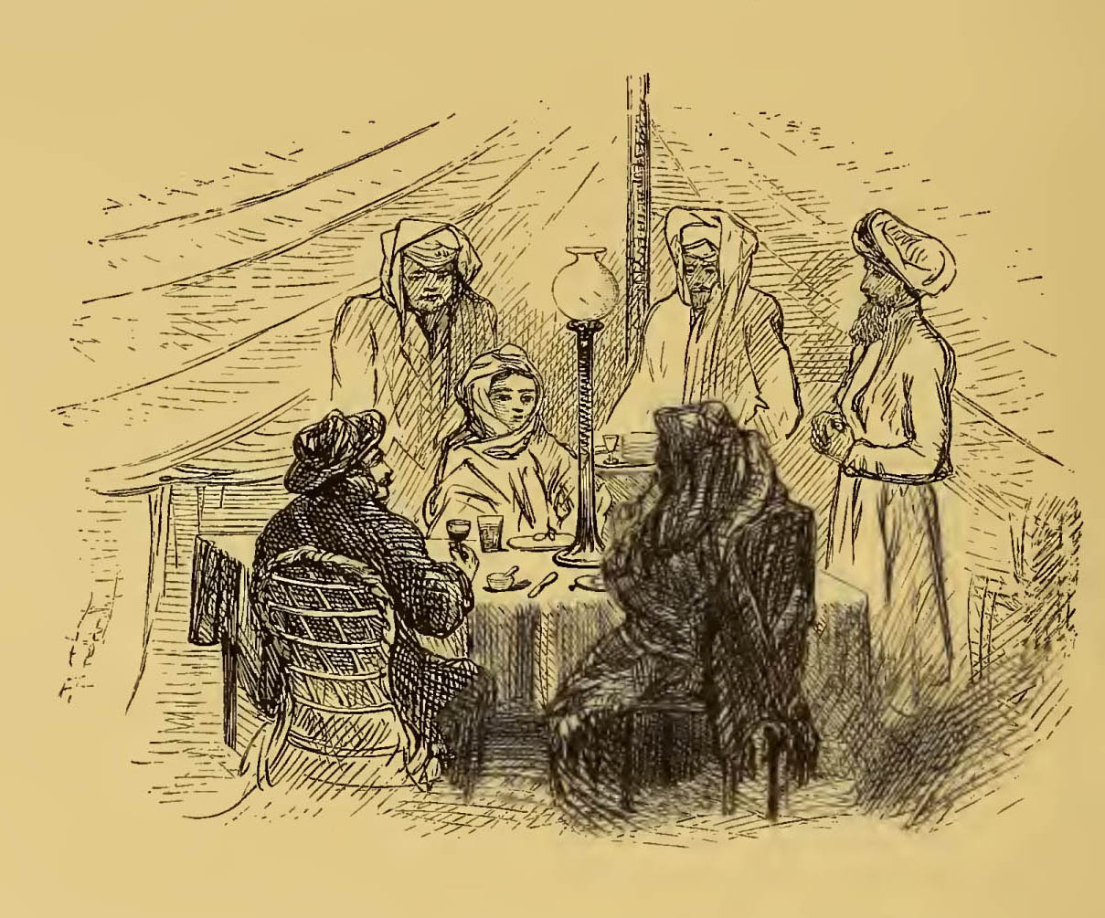 group dining at table in tent