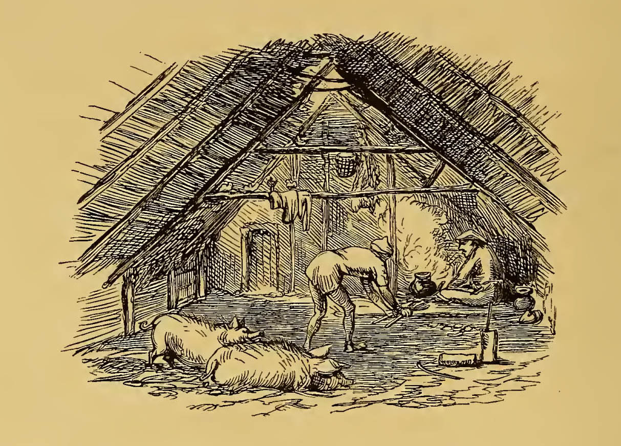 hut interior with man standing over a fire