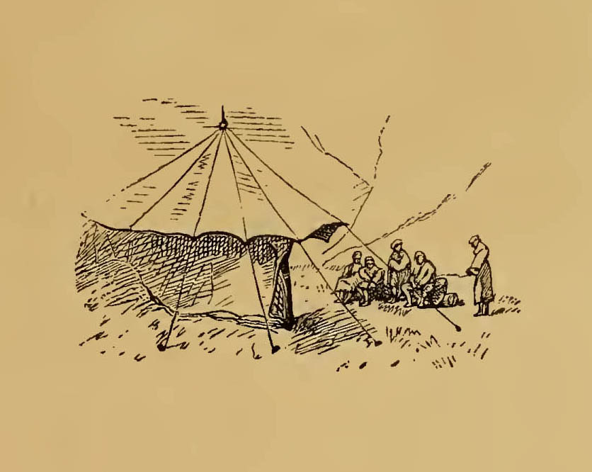group sitting by tent