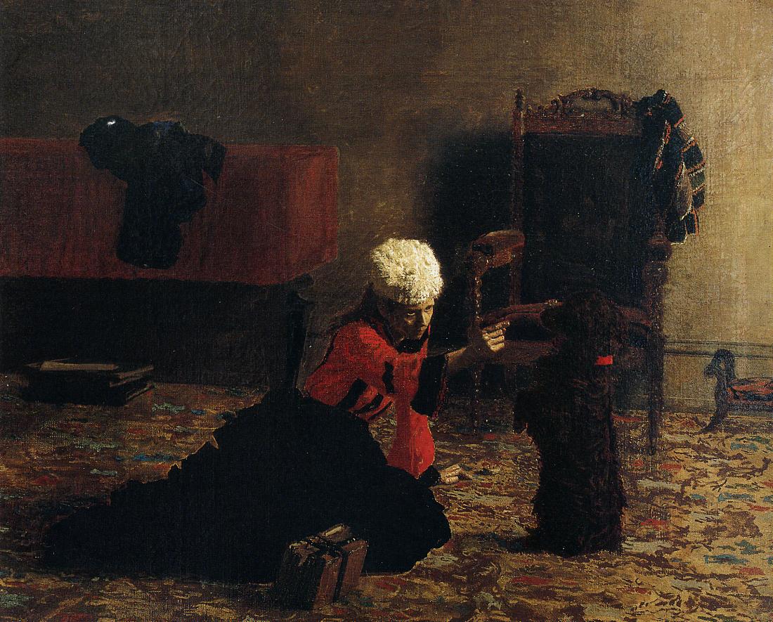 woman sitting on floor playing with dog