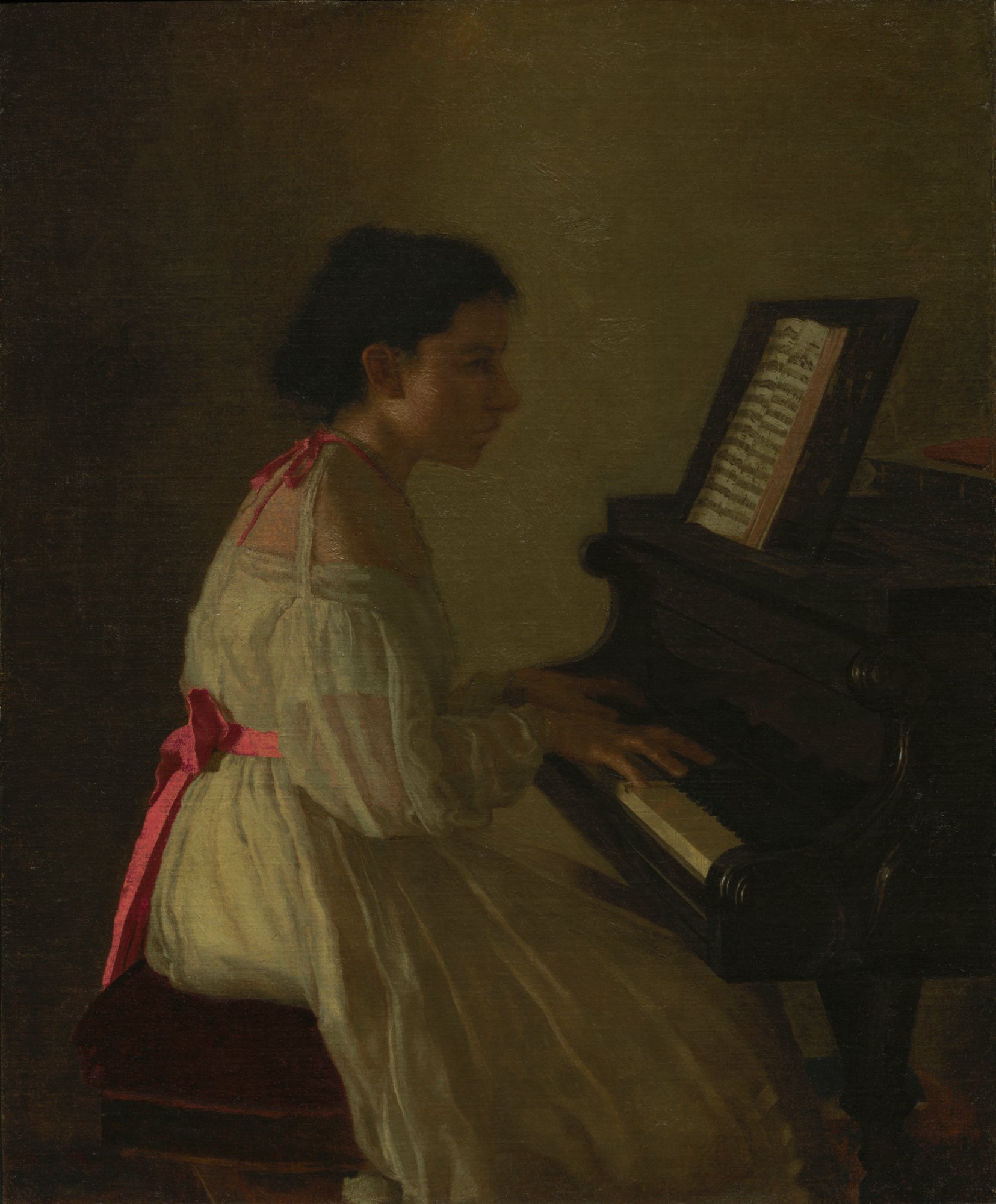 woman in white dress at a piano