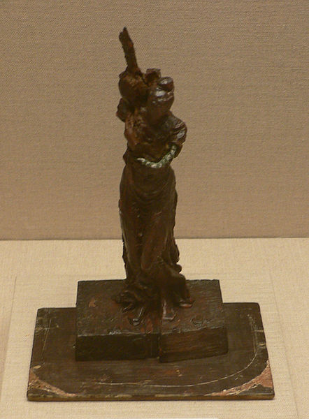 sculpture of woman with bird