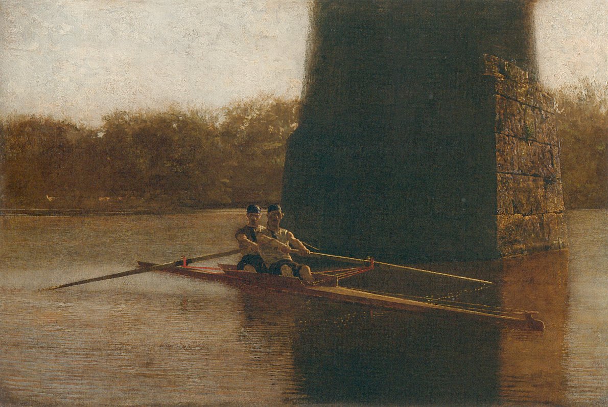 two men rowing on a river