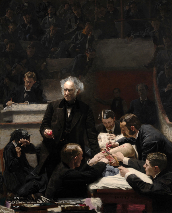 men performing a medical operation while students observe