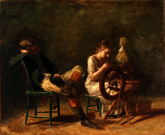 man reclining in chair with woman working at spinning wheel
