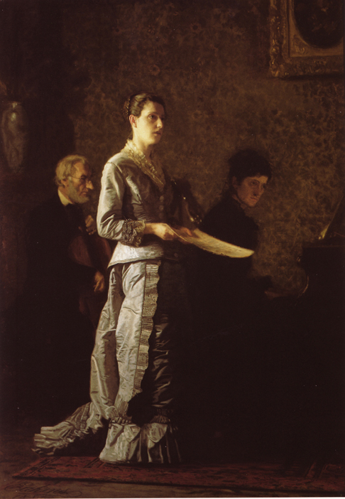 woman holding sheet music singing