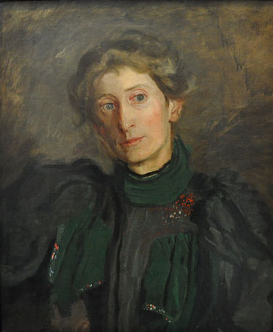woman in dark dress with green collar