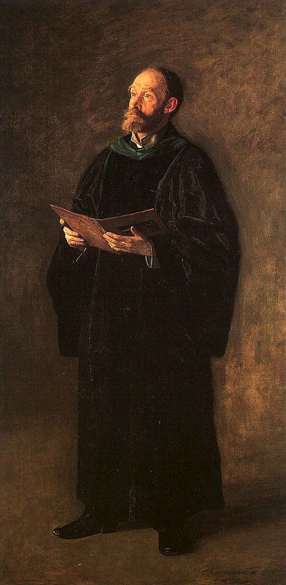 man in academic robe with book