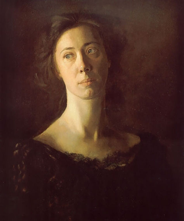 woman in black dress with long neck