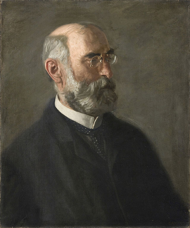 balding man with gray beard and glasses