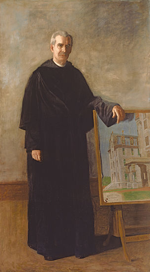 man in black religious garment standing next to a painting
