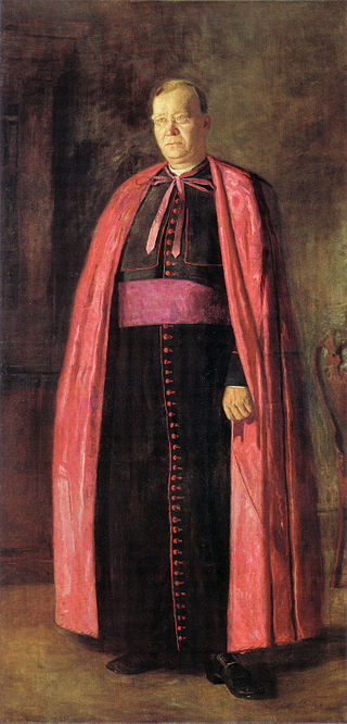 man in black and red religious garment