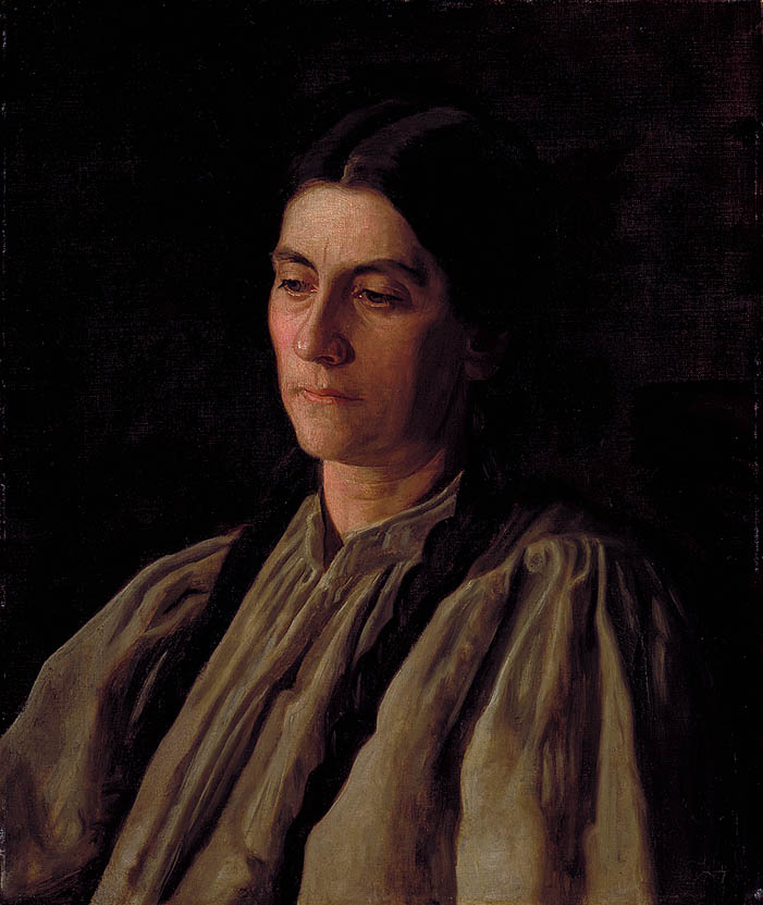 woman with dark hair in two long braids
