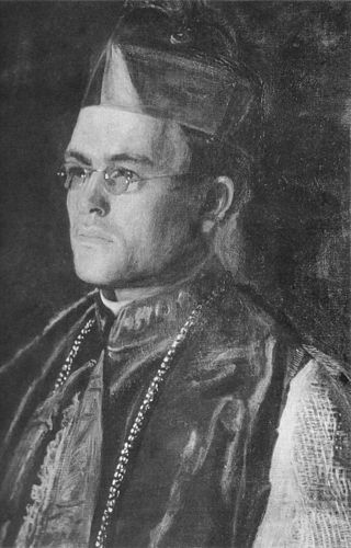 man with glasses in religious garment