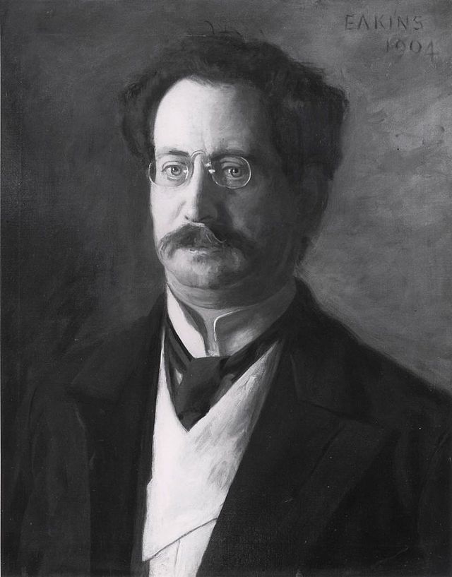 man with moustache and glasses