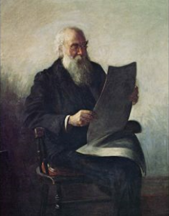 elderly man with beard reading newspaper