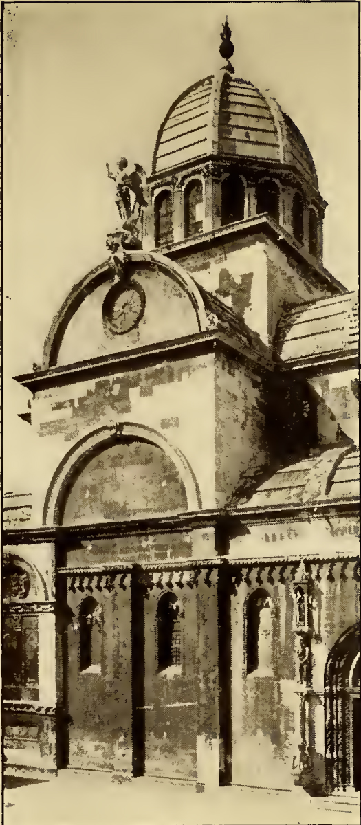 Large domed cathedral with angel statue over entry. Caption: Sebenico Giorgio's Famous Cathedral.