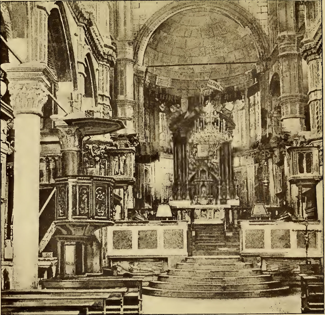 Ornate cathedral interior, facing altar. Caption: Interior of Cathedral.