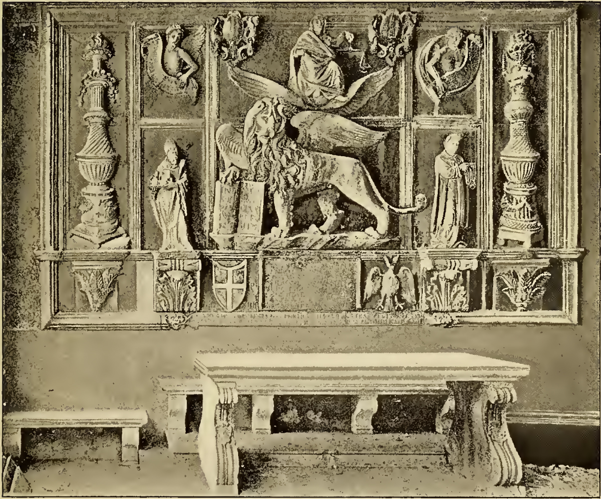Wall carved with winged lion and figure holding scales. Caption: Traü Interior of Loggia.
