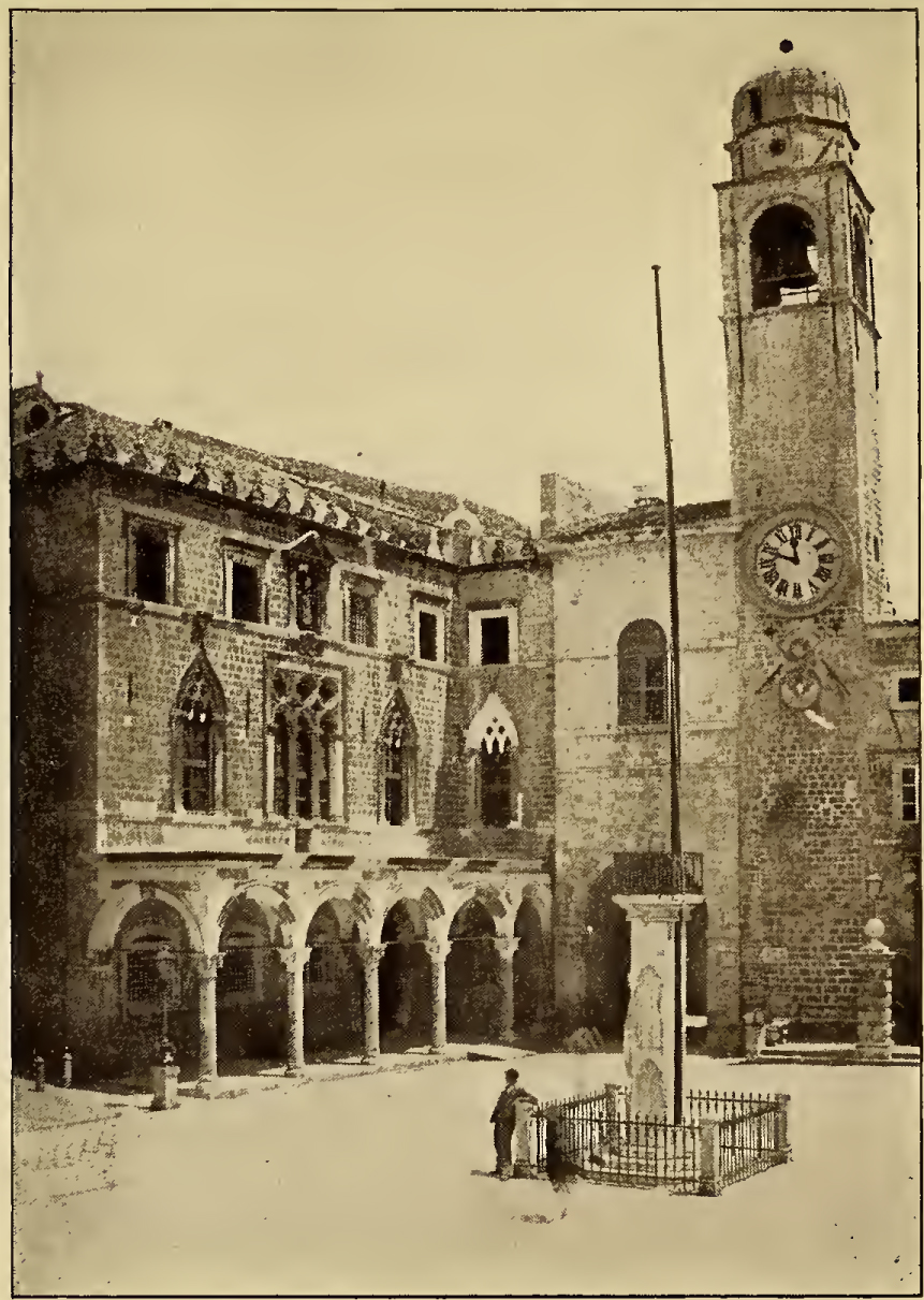 Town square with clock-tower. Caption: Piazza, Antique Standard and Clock-Tower.