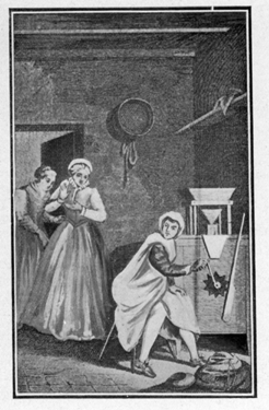 two women looking at man turning a crank