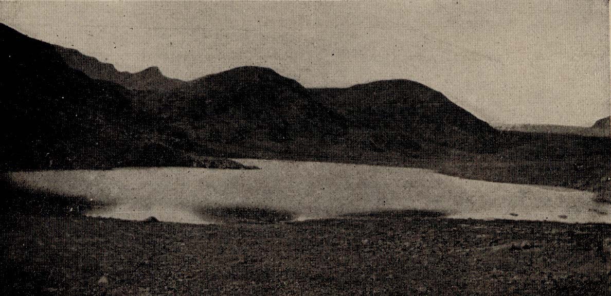 A small Lake, hills behind.