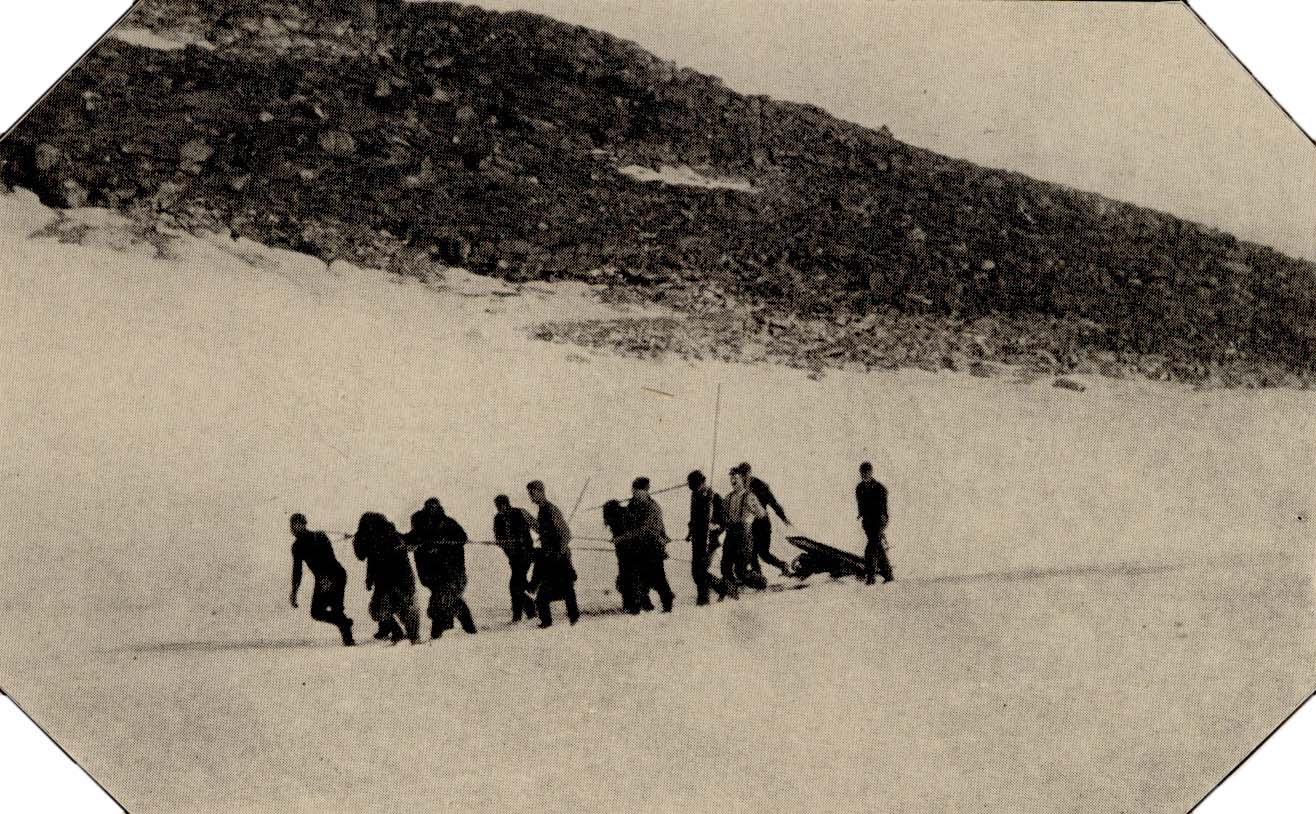 Men Hauling a sledge over Rocks and Snow