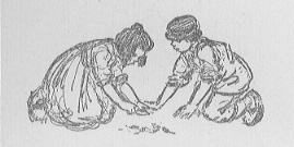 girl and boy kneeling, playing in the field