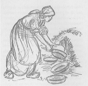woman putting cooking pans on a pile of straw