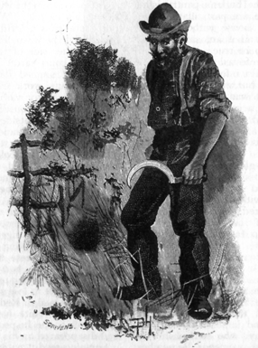 Image of a man with a beard wearing a plaid shirt and suspenders, standing in the grass. His posture is slumped and he's looking to the side while holding a sickle.