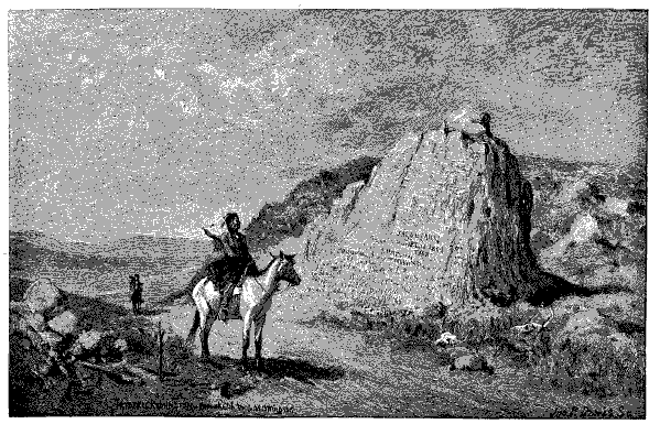 Man on horseback standing before a large smooth faced rock, known as Register Rock.