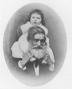 old bearded man with child on shoulders