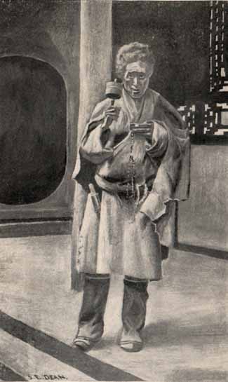 man with beads and prayer wheel