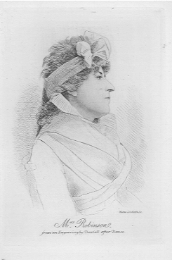 Woman with cropped hair wearing a bow around her head.