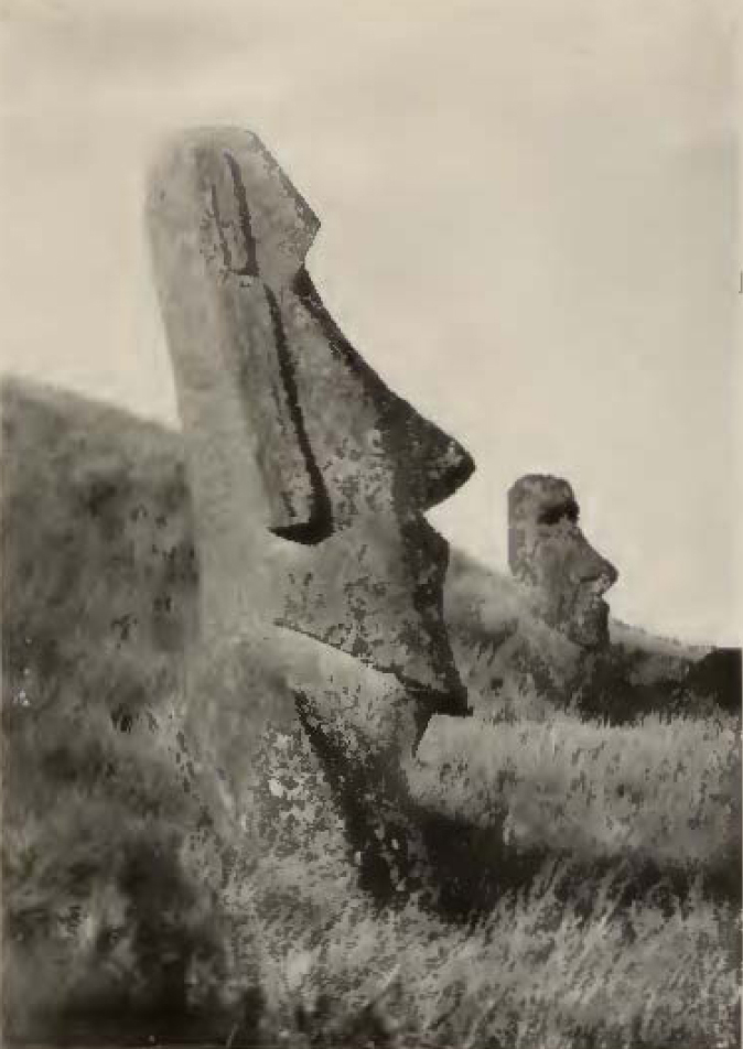 Humorous moai sculpture with pilot helmet