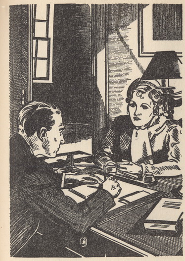Woman and man sitting across a desk from each other. Man is writing.