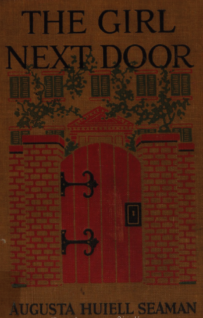 Yellow, red, black, and green cloth cover with an image of the top of a vine covered house peeking out overtop of a brick wall with a large red wooden door.
