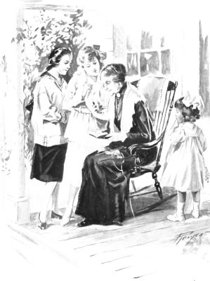 Two girls and a smaller girl stand on either side of an older woman in a chair.
