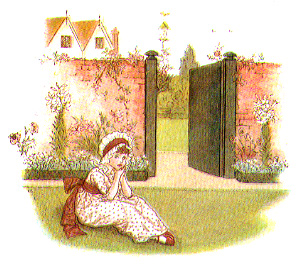 young girl sitting on the grass outside a gate