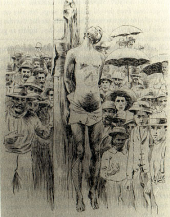 man hanged from a post amid a crowd of onlookers