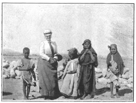 woman standing with children